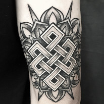 Fine line black and grey Celtic Knot arm tattoo by tattoo artist Alan Lott of Sacred Mandala Studio in Durham, NC.